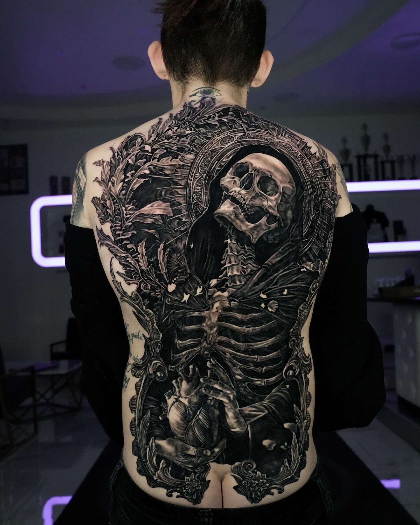 Skeleton and heart realism tattoo on the back by Stacy Lavette
