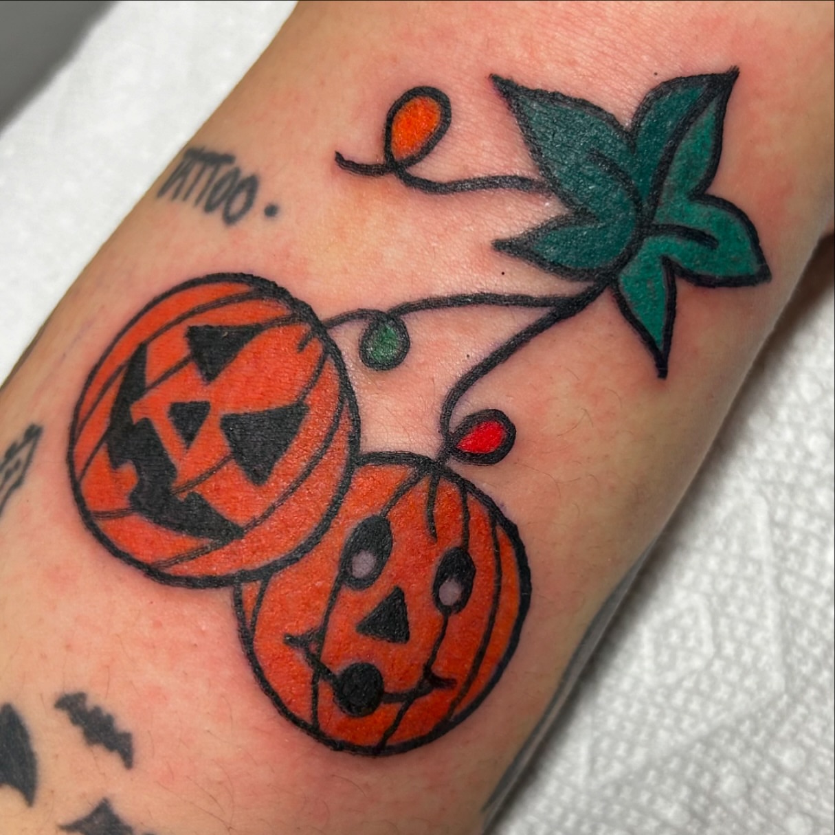 Pumpkin jack-o'-lanterns American traditional tattoo on the forearm by Lauren Caldwell 🔮🌙