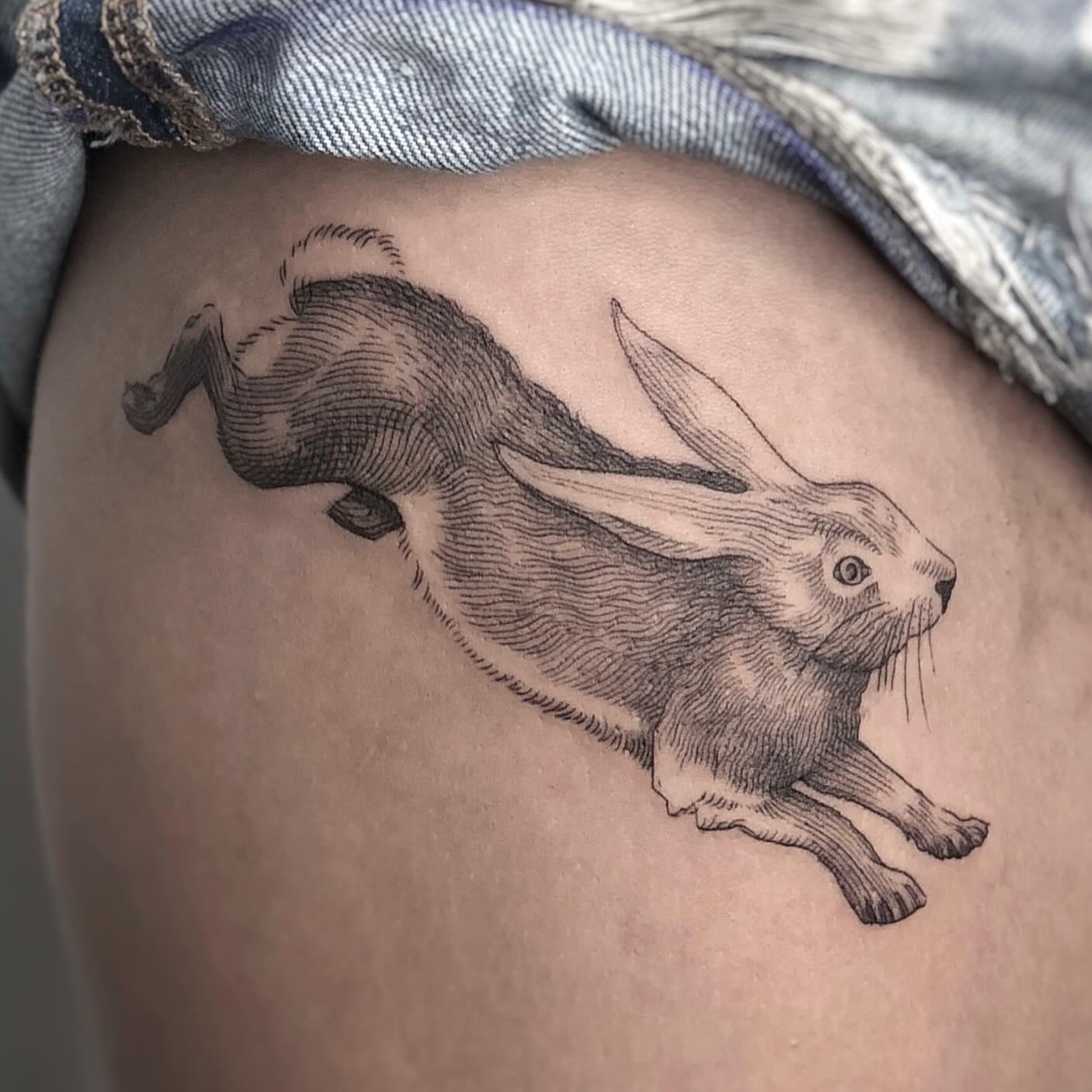 Hare realism tattoo on the thigh by Jorge Nox