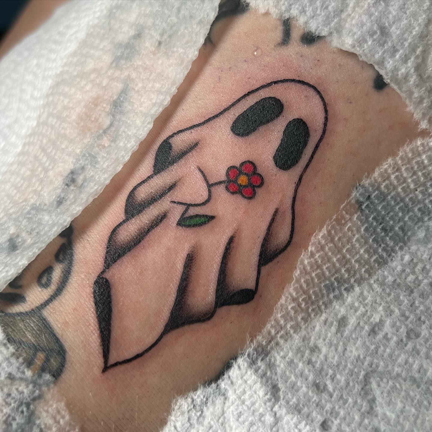 Ghost with flower American traditional tattoo on the forearm by ✮KAT✮