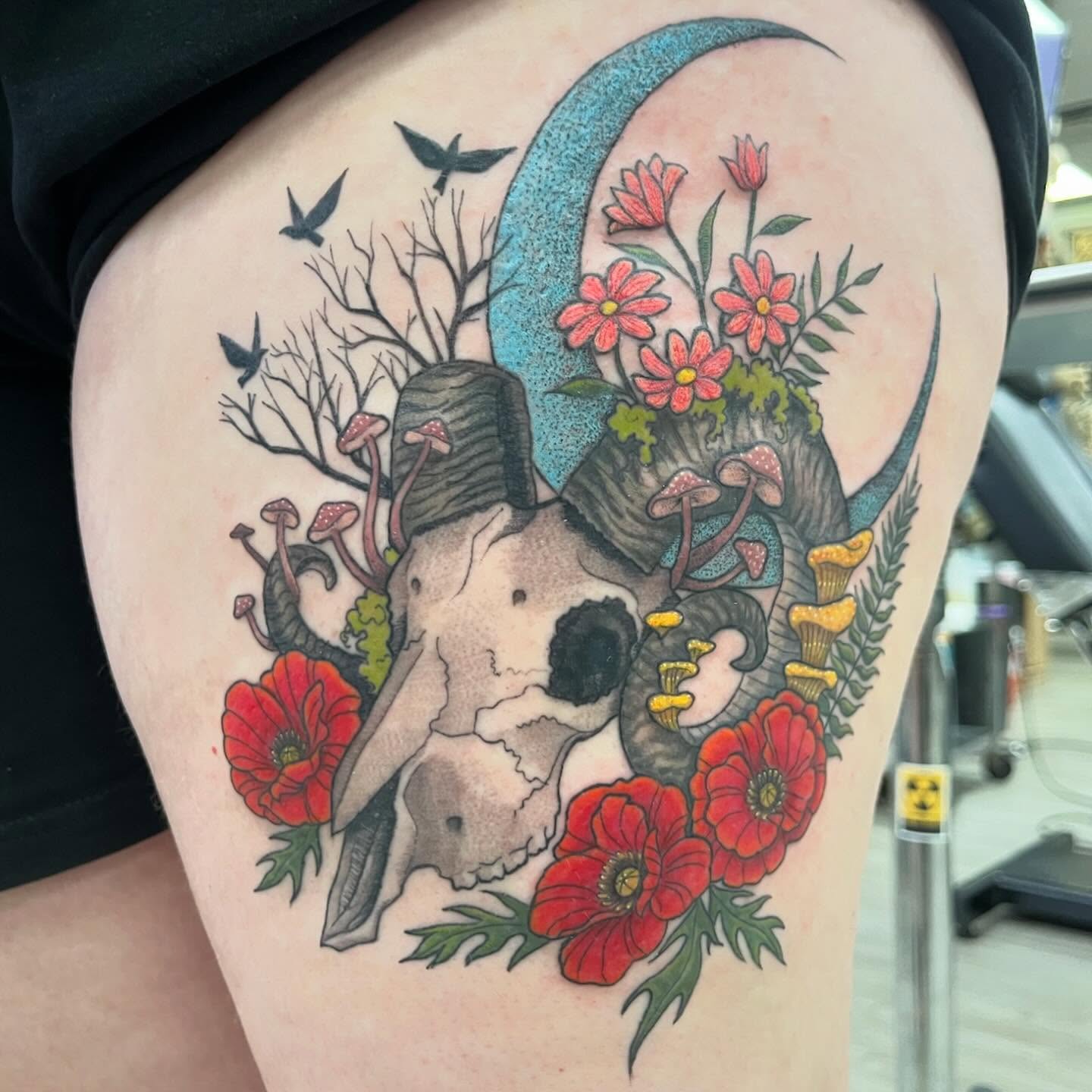 Skull and flowers dotwork tattoo on the thigh by Tattoos by Gina Palladino