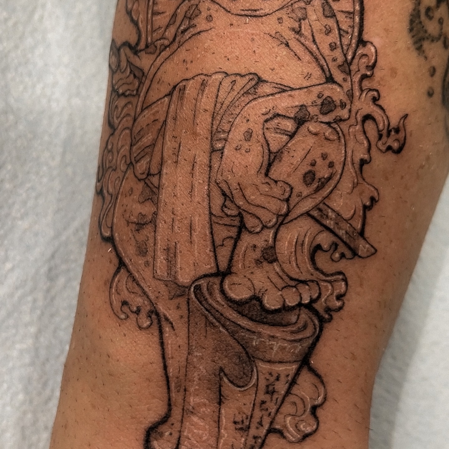 Lion black and grey tattoo on the forearm by Grace Zarmina Hessam