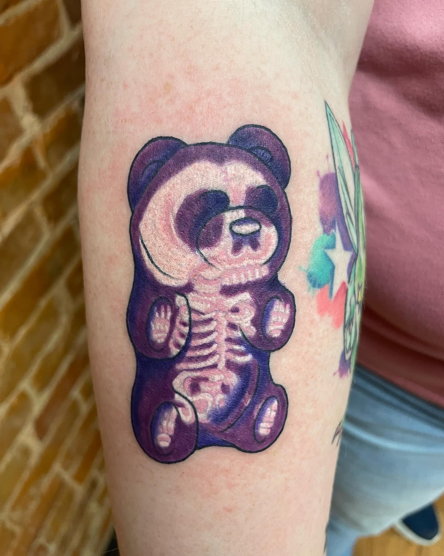 Purple teddy bear skeleton dotwork tattoo on the forearm by Auzzy the Ink Pirate, Mansfield, Ohio
