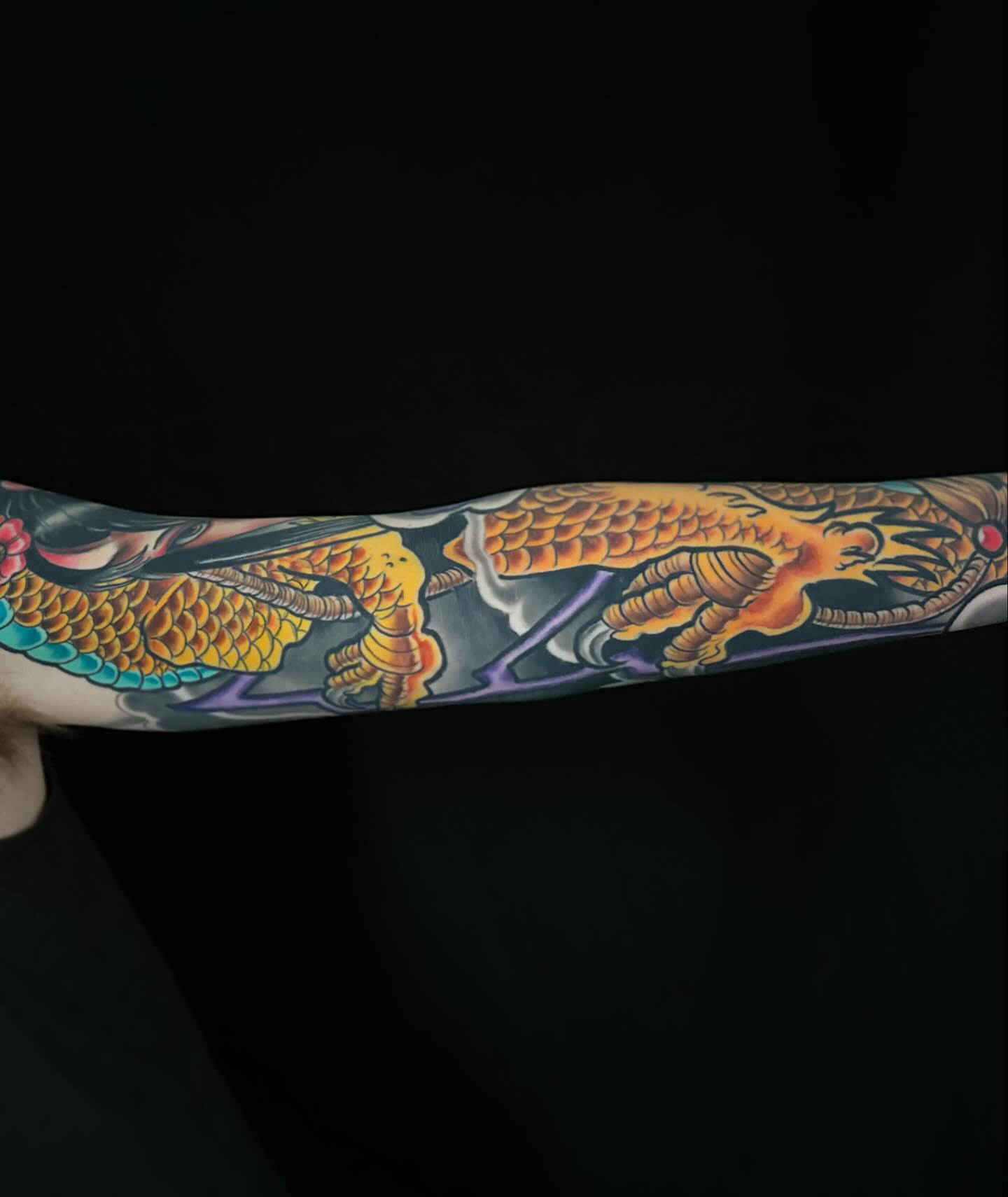 Dragon American traditional tattoo on the forearm by John Milosh Chamberlin