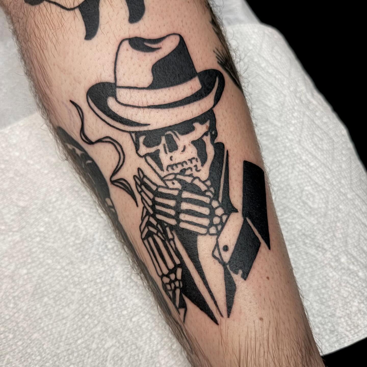 Skull wearing hat black and grey tattoo on the forearm by Han shinko, Portland, Oregon