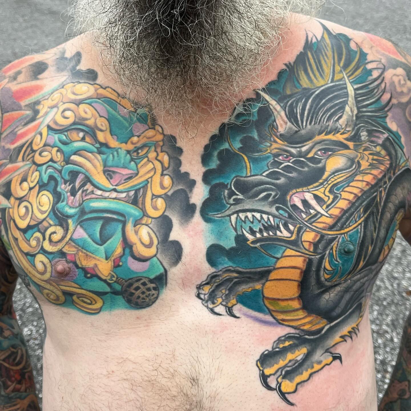 Lion and dragon japanese irezumi tattoo on the chest by scottyjstattoos