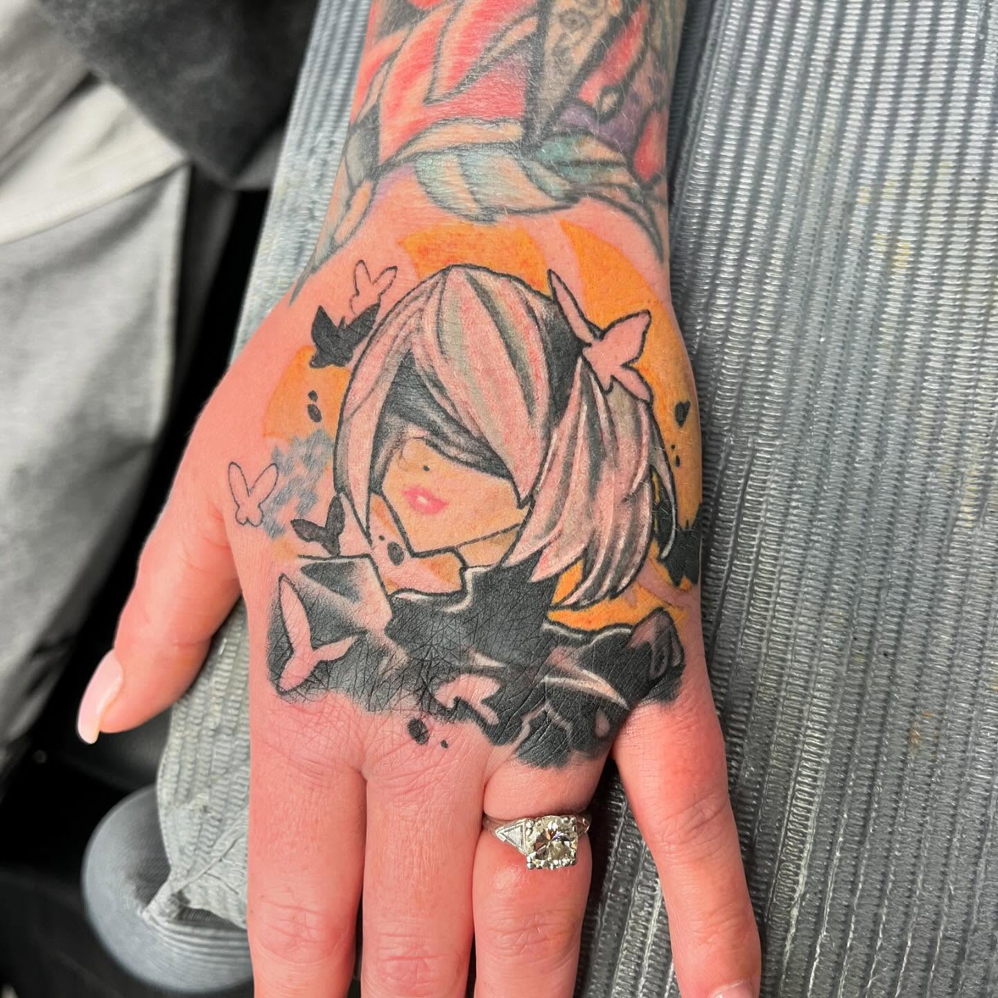 Anime character anime tattoo on the hand by scottyjstattoos