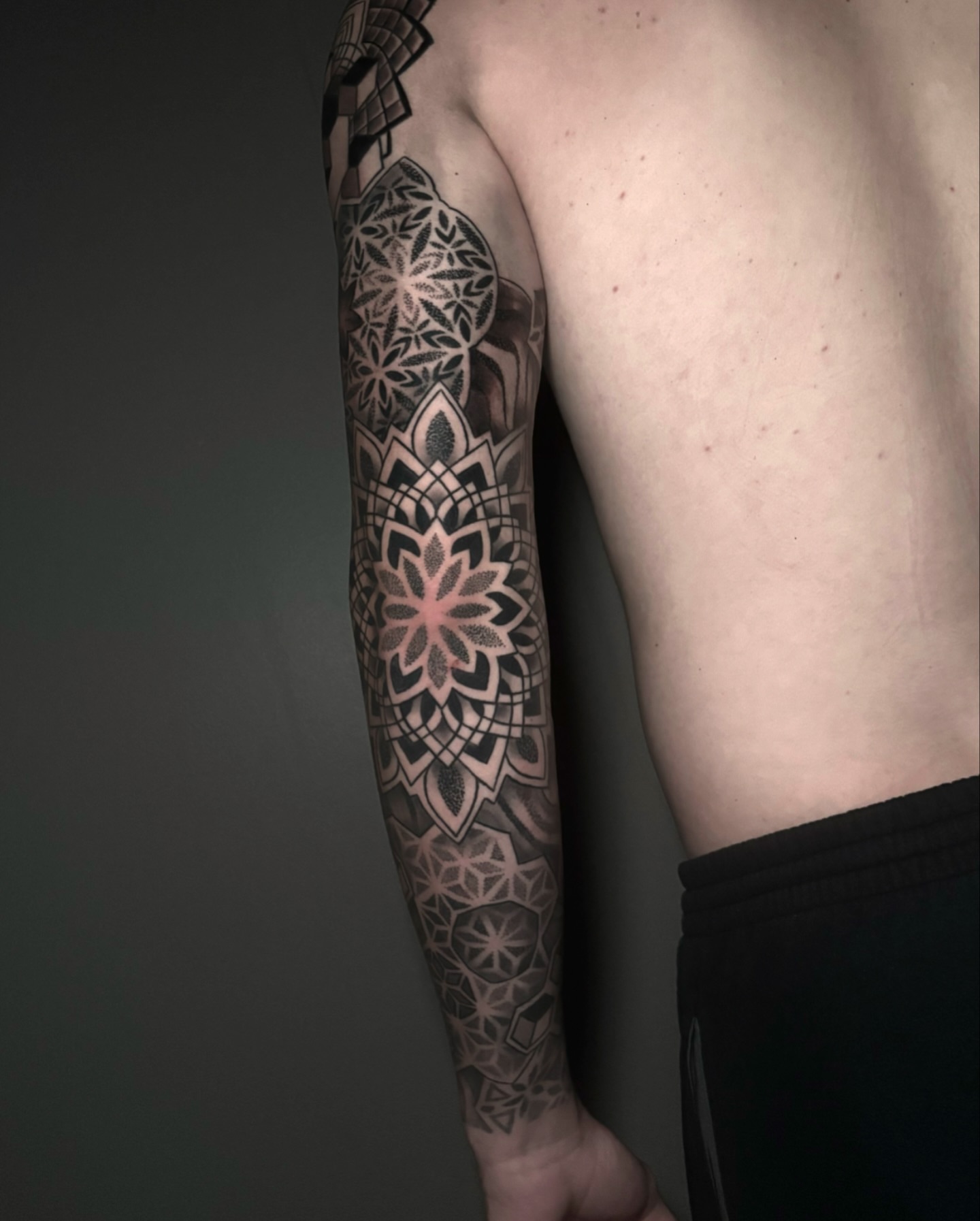 Geometric mandala geometric tattoo on the forearm by Eric Hare