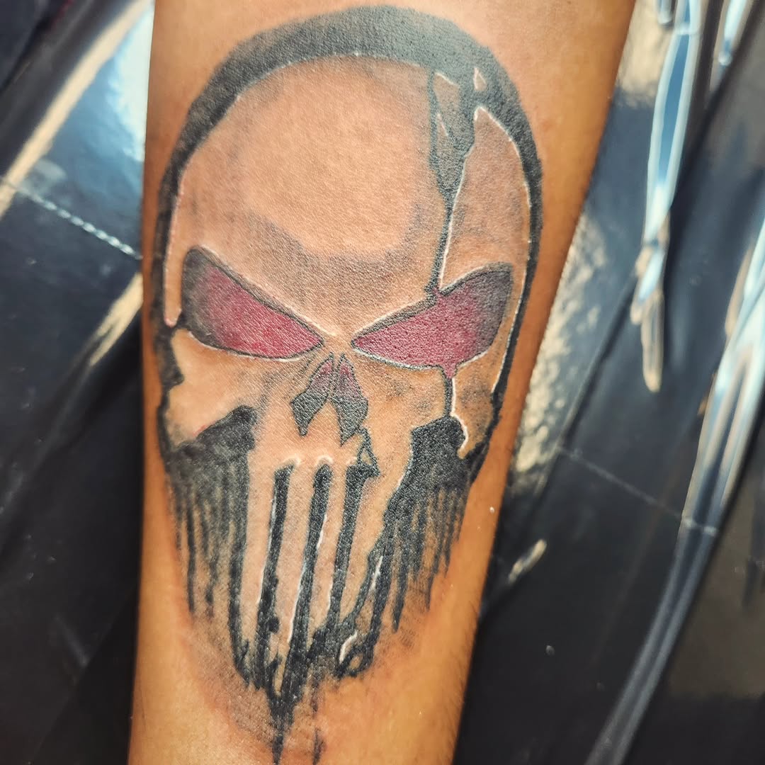 Punisher skull tattoo on the forearm by Lopez Dautruche