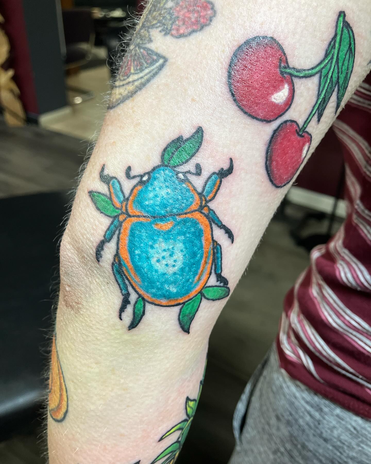 Beetle American traditional tattoo on the forearm by Madeline, Akron, Ohio