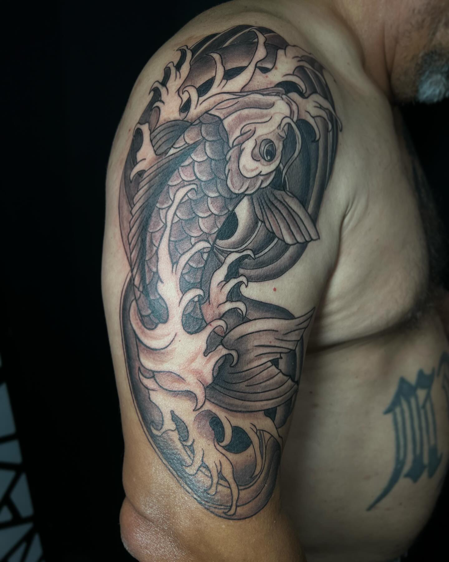 Koi fish japanese irezumi tattoo on the shoulder by Daphne Landry