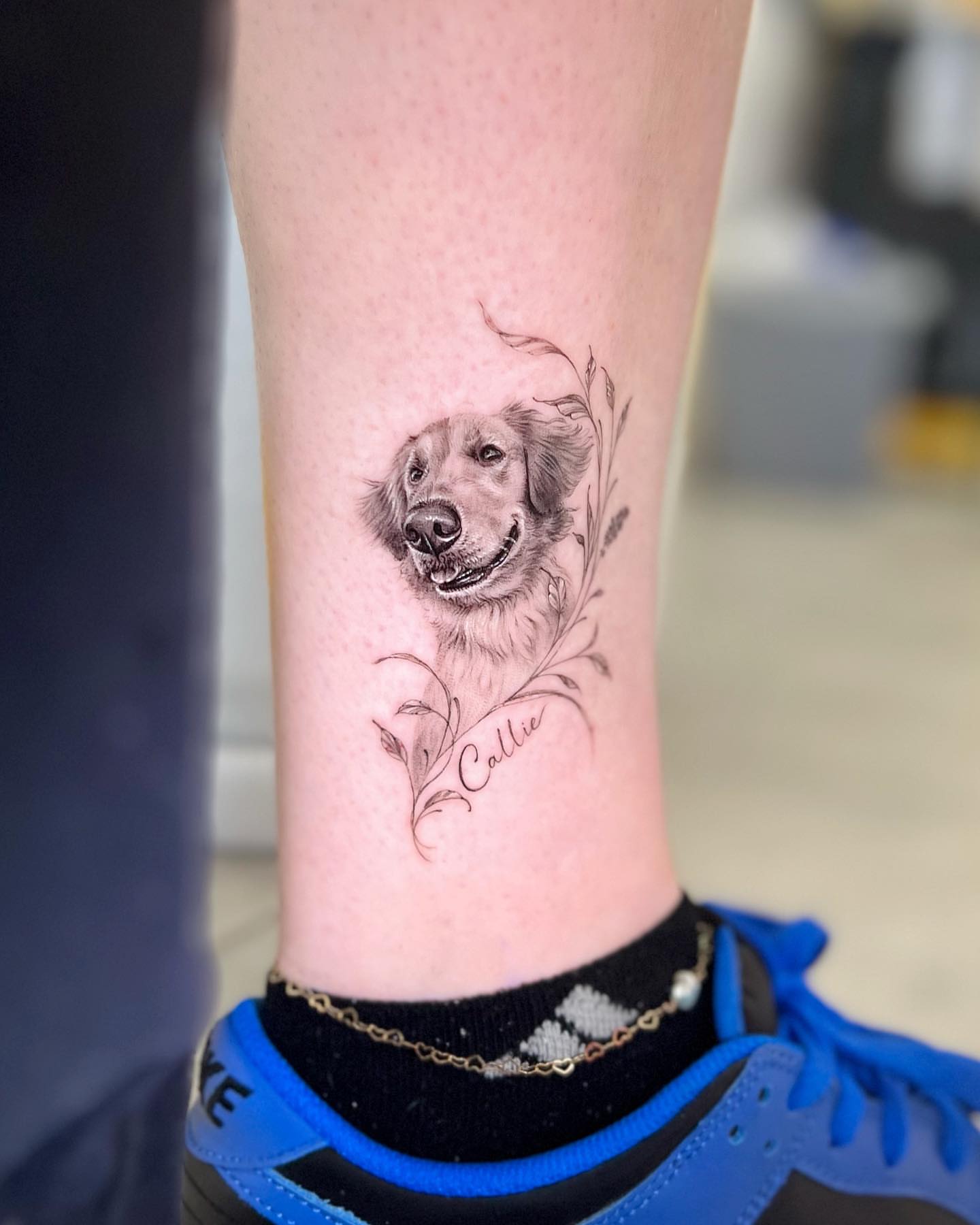 Dog portrait realism tattoo on the calf by Nana