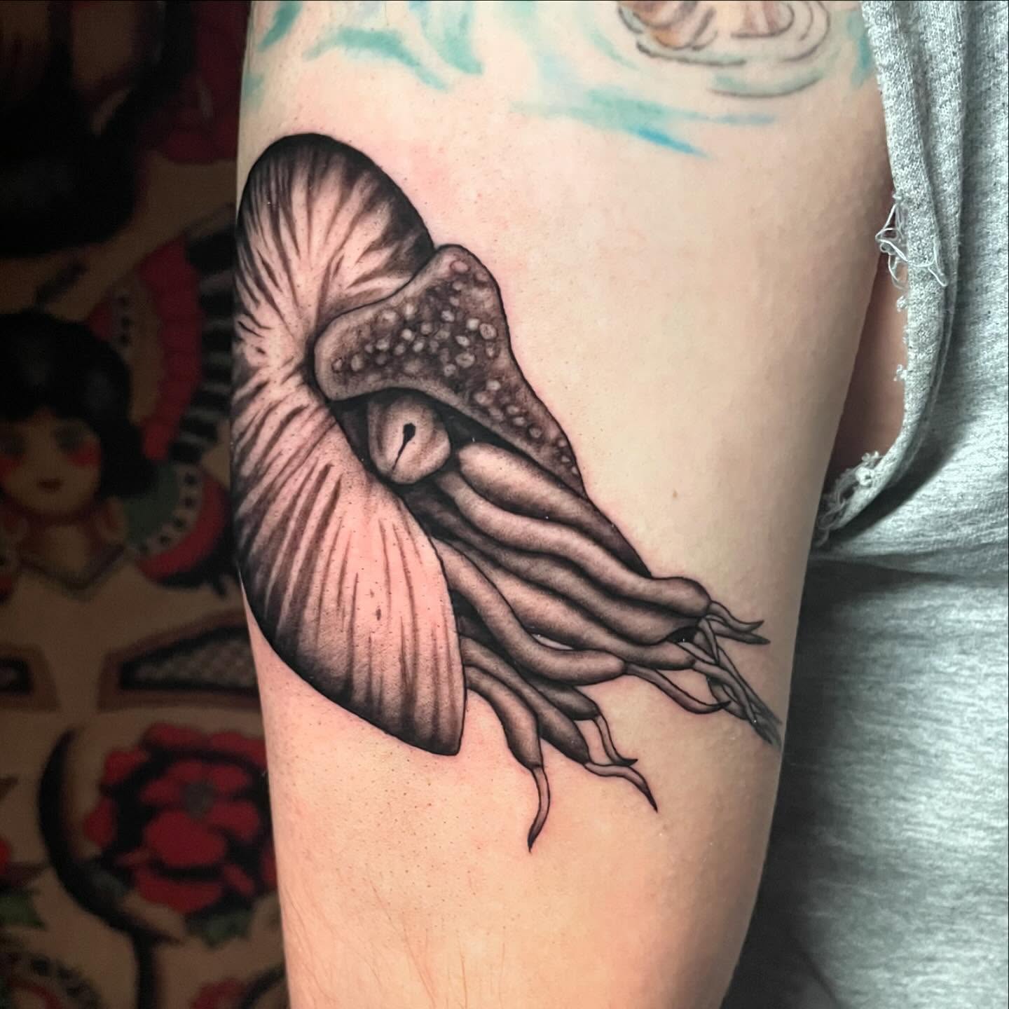 Squid realism tattoo on the forearm by Alexis Monkiewicz