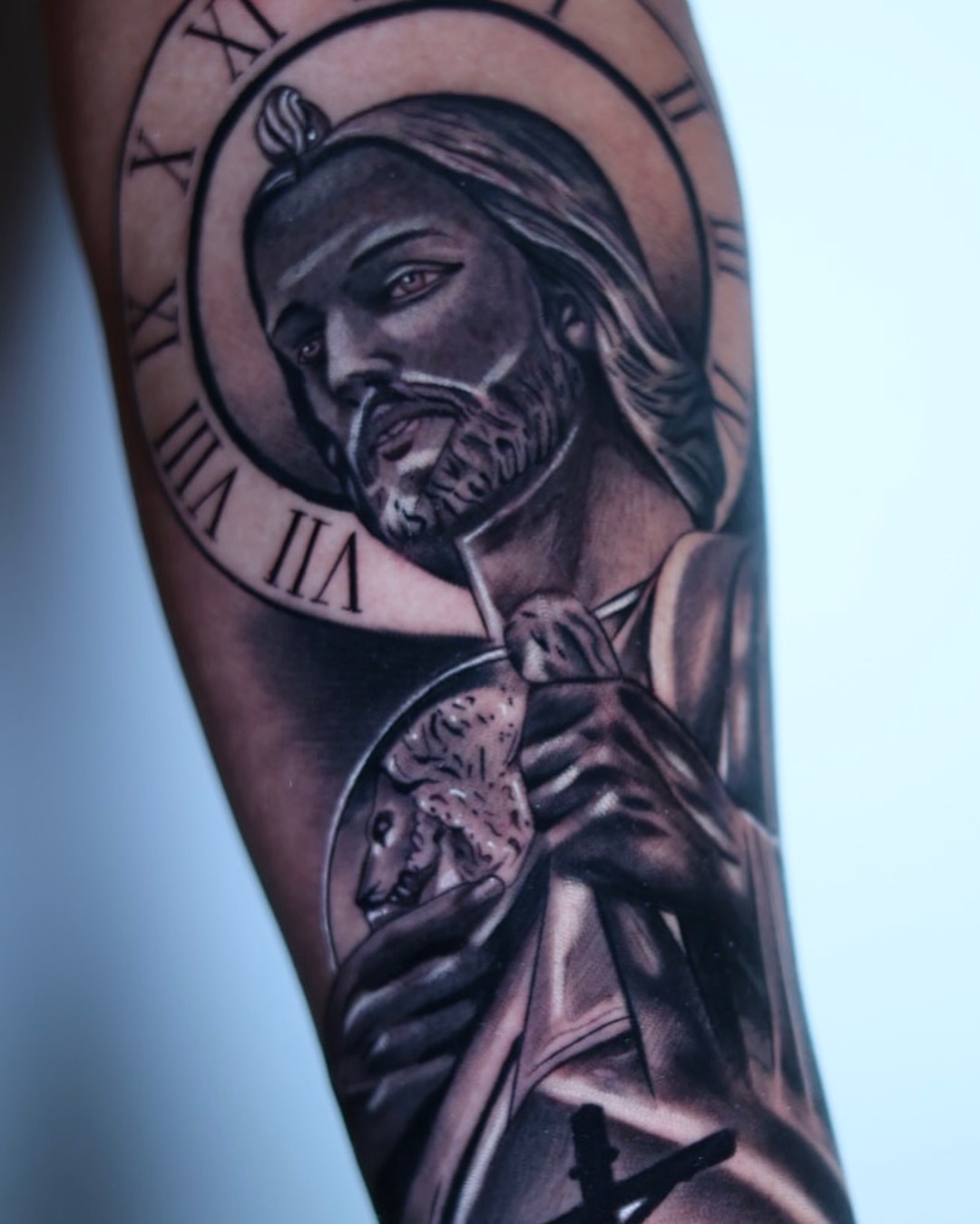 Religious figure realism tattoo on the forearm by Tiago Ink
