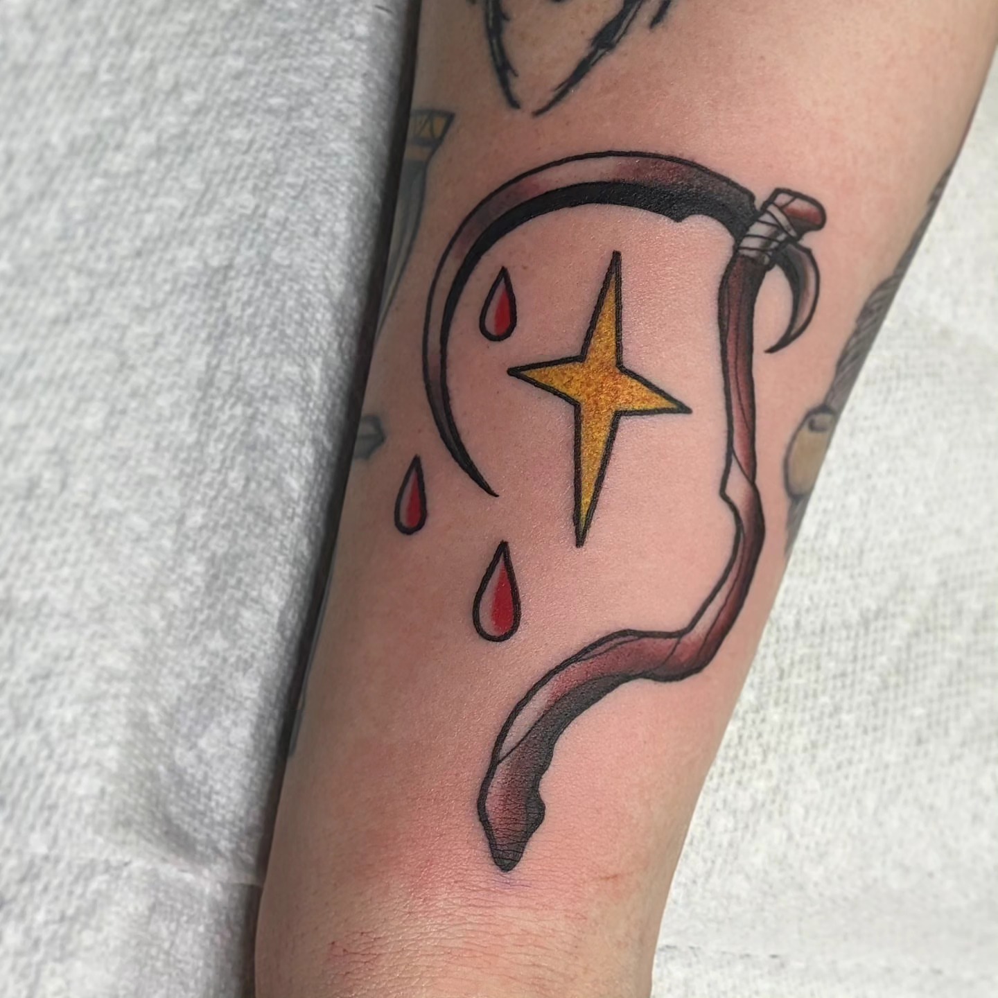 Sword and star American traditional tattoo on the forearm by Joe McElravy