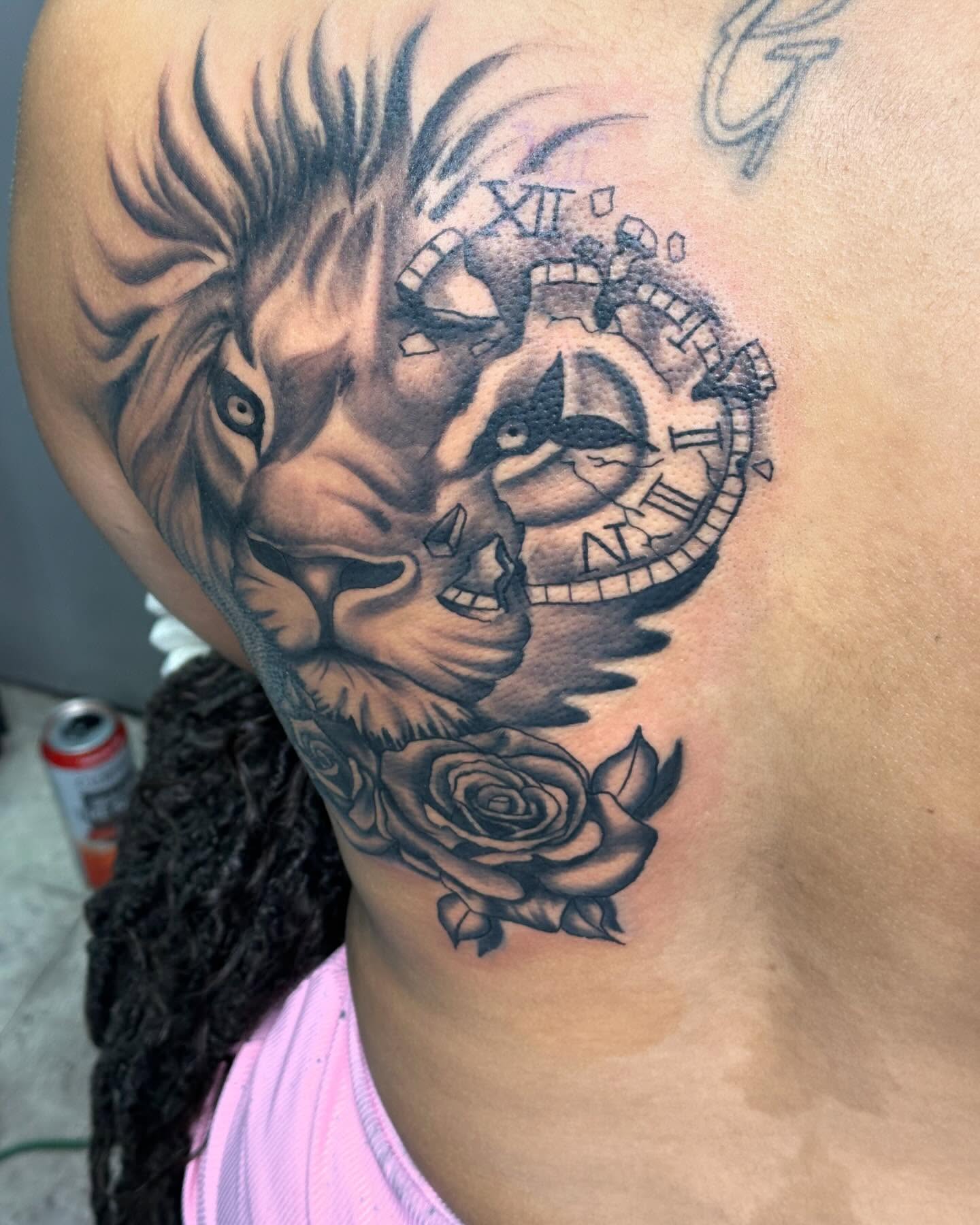 Lion and clock realism tattoo on the shoulder by Mr. Tatt2Junkiee 💉🧟