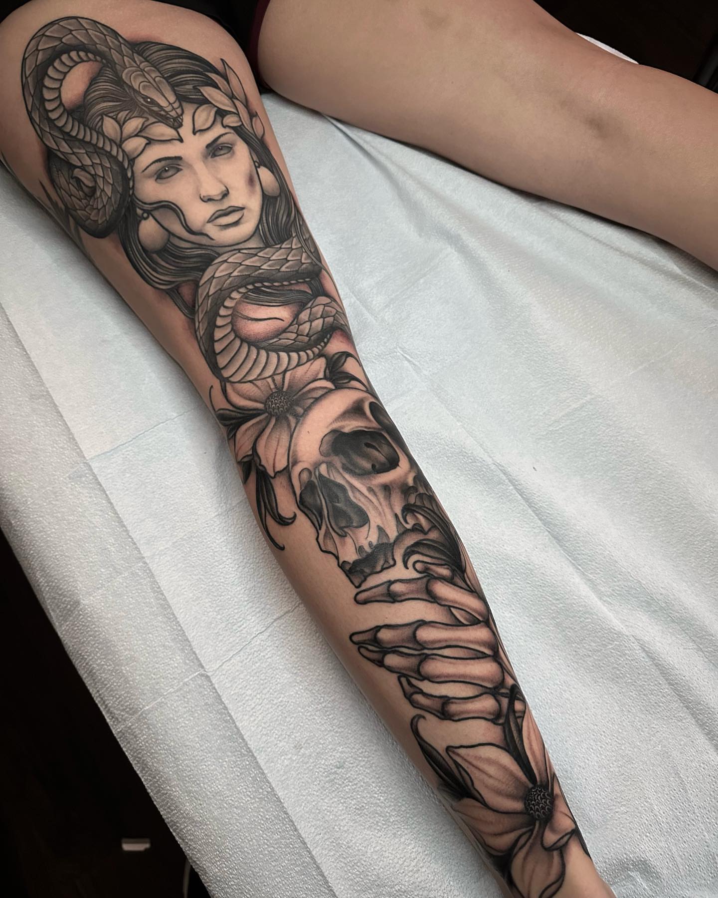 Woman with snake American traditional tattoo on the forearm by Henry Gaßner