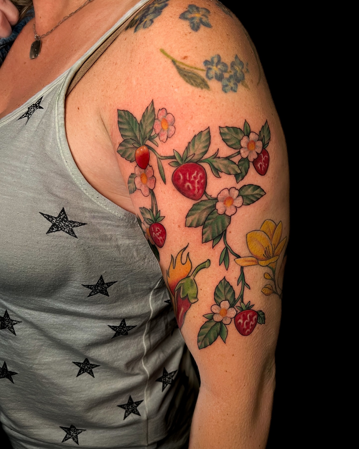 Strawberry plant new school tattoo on the shoulder by Demi DiMartino