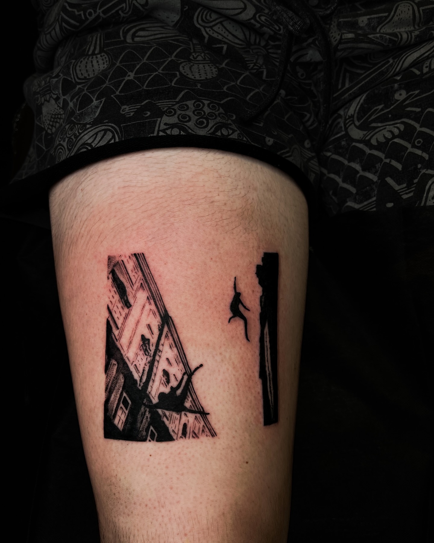 Building silhouette black and grey tattoo on the thigh by Demi DiMartino