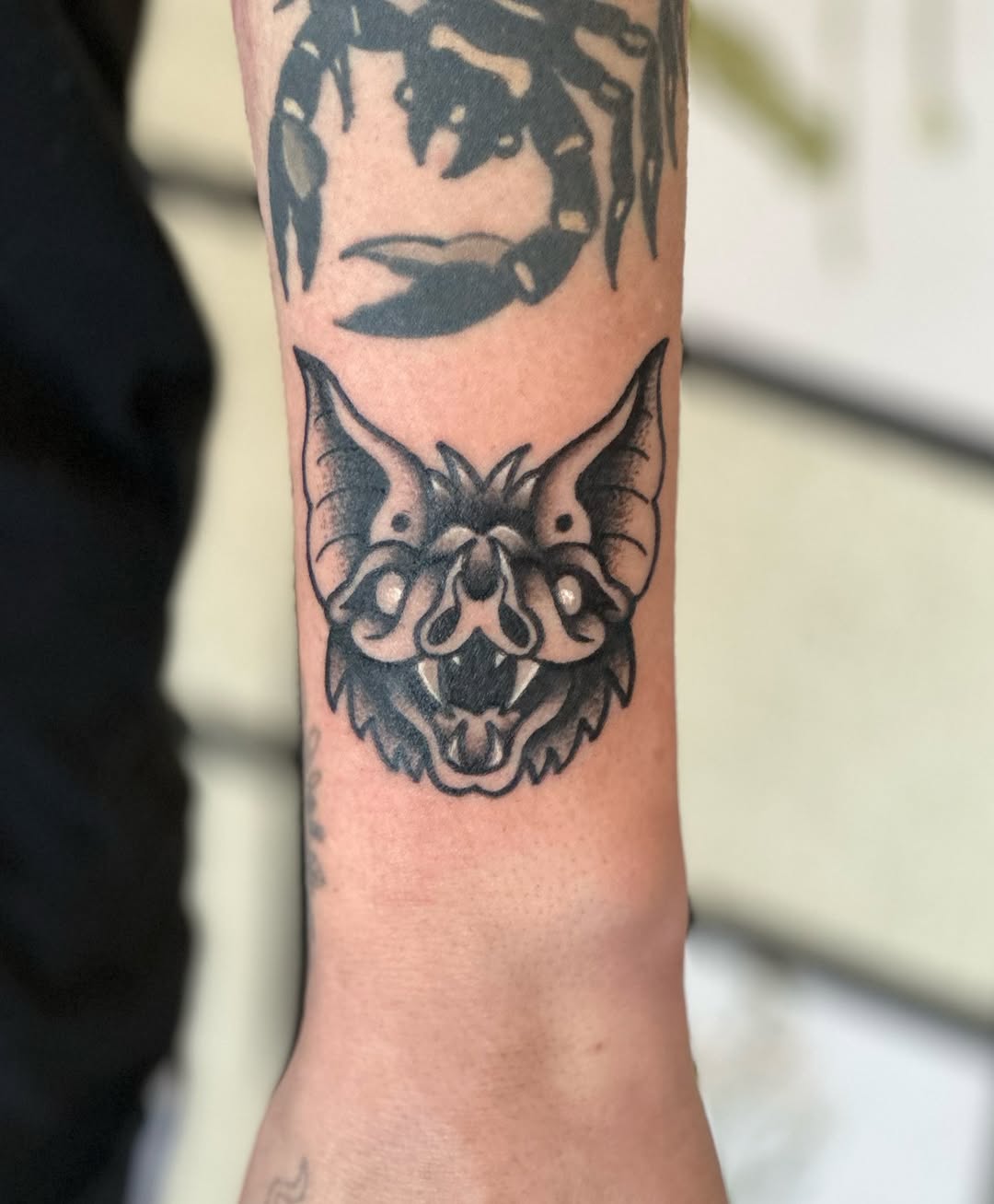 Bat head dark art tattoo on the forearm by CJ