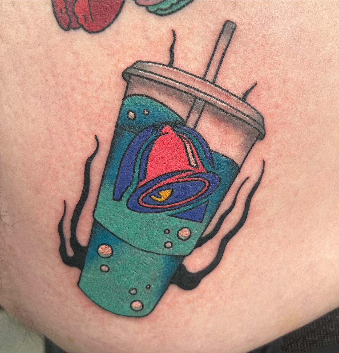 Space drink American traditional tattoo on the thigh by Abbi