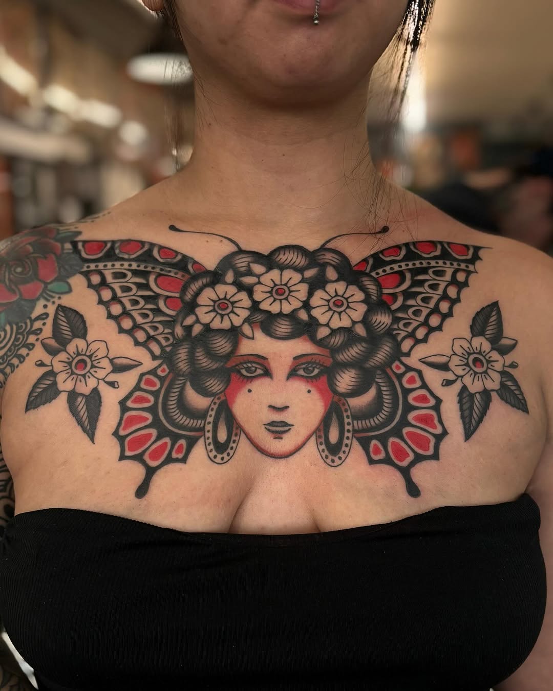 Woman with butterfly wings neo-traditional tattoo on the chest by Jesse Smith, Chicago, Illinois