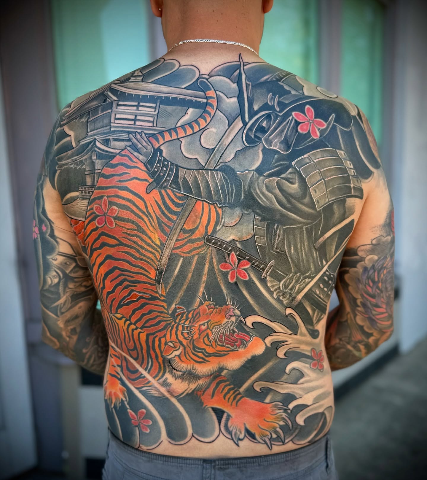 Tiger and samurai japanese irezumi tattoo on the back by Eduardo Gomez