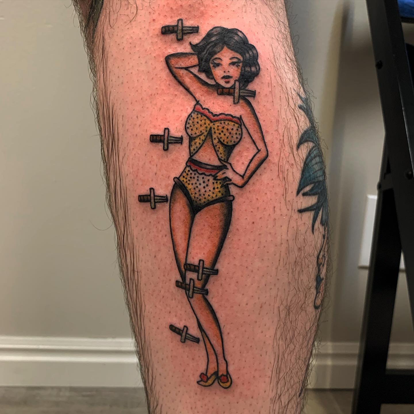 Pin-up girl American traditional tattoo on the leg by Brii Moser