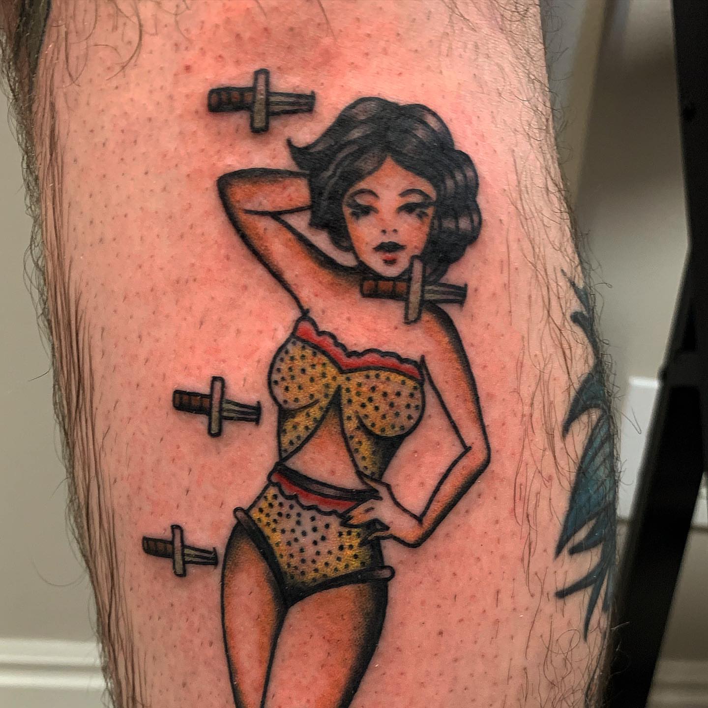 Pin-up girl American traditional tattoo on the thigh by Brii Moser