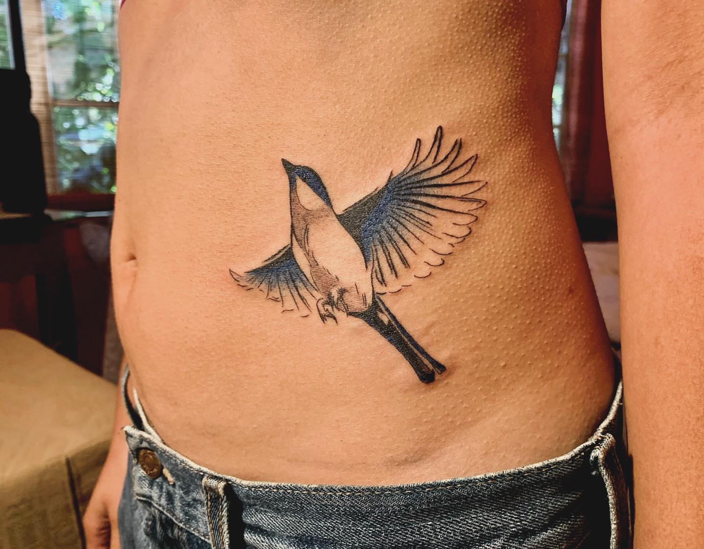 Bird realism tattoo on the ribs by *:・kelly✧*:・゚
