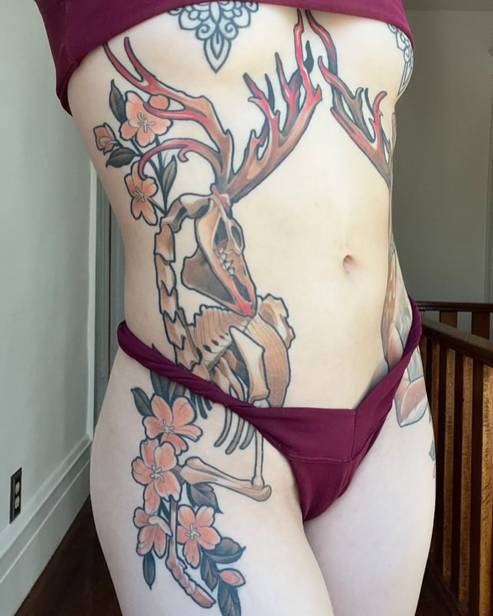 Deer skeleton with cherry blossoms American traditional tattoo on the torso by Matt - Neotrad Tattoos, New York, New York
