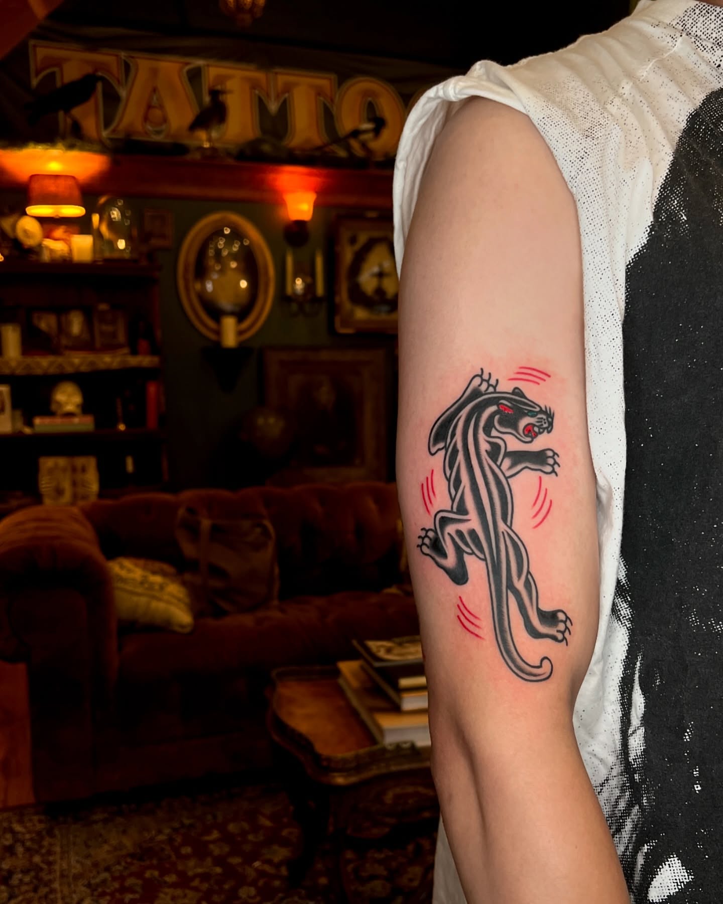 Panther American traditional tattoo on the forearm by Ian Jett