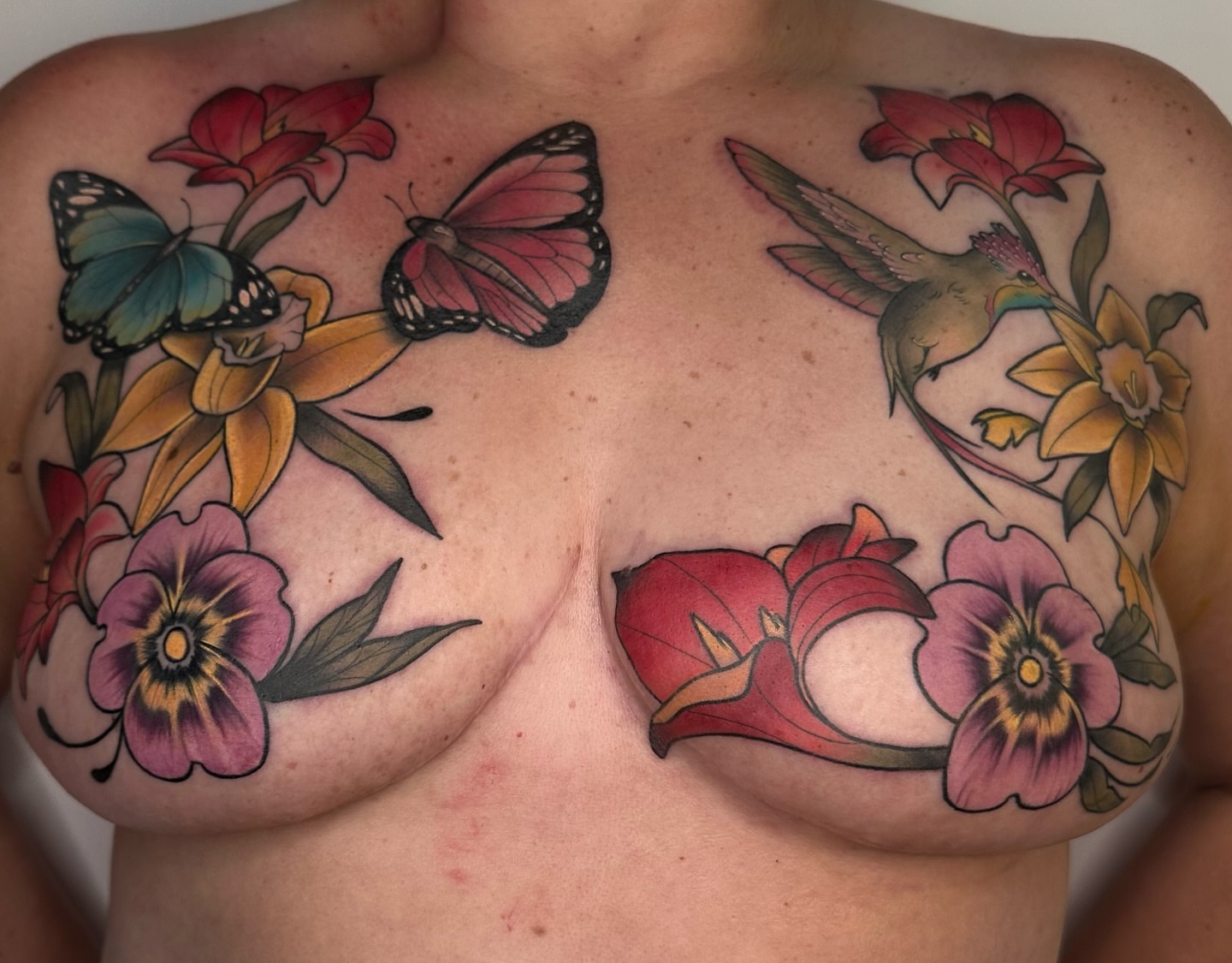 Flowers and butterflies American traditional tattoo on the chest by alex h🪴 neotrad