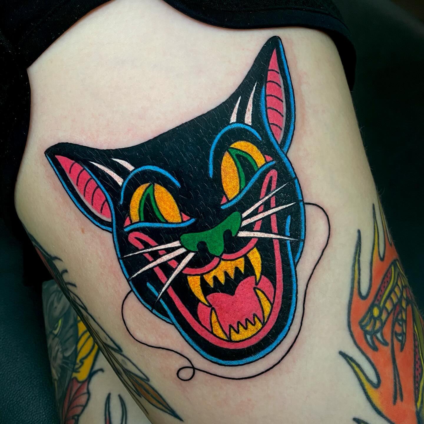Cat American traditional tattoo on the thigh by Justin R. Mitchell, Fort Worth, Texas