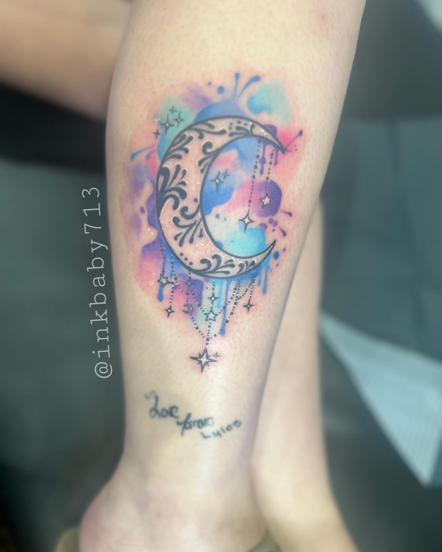 Watercolor crescent moon watercolor tattoo on the forearm by Ayanna Luna