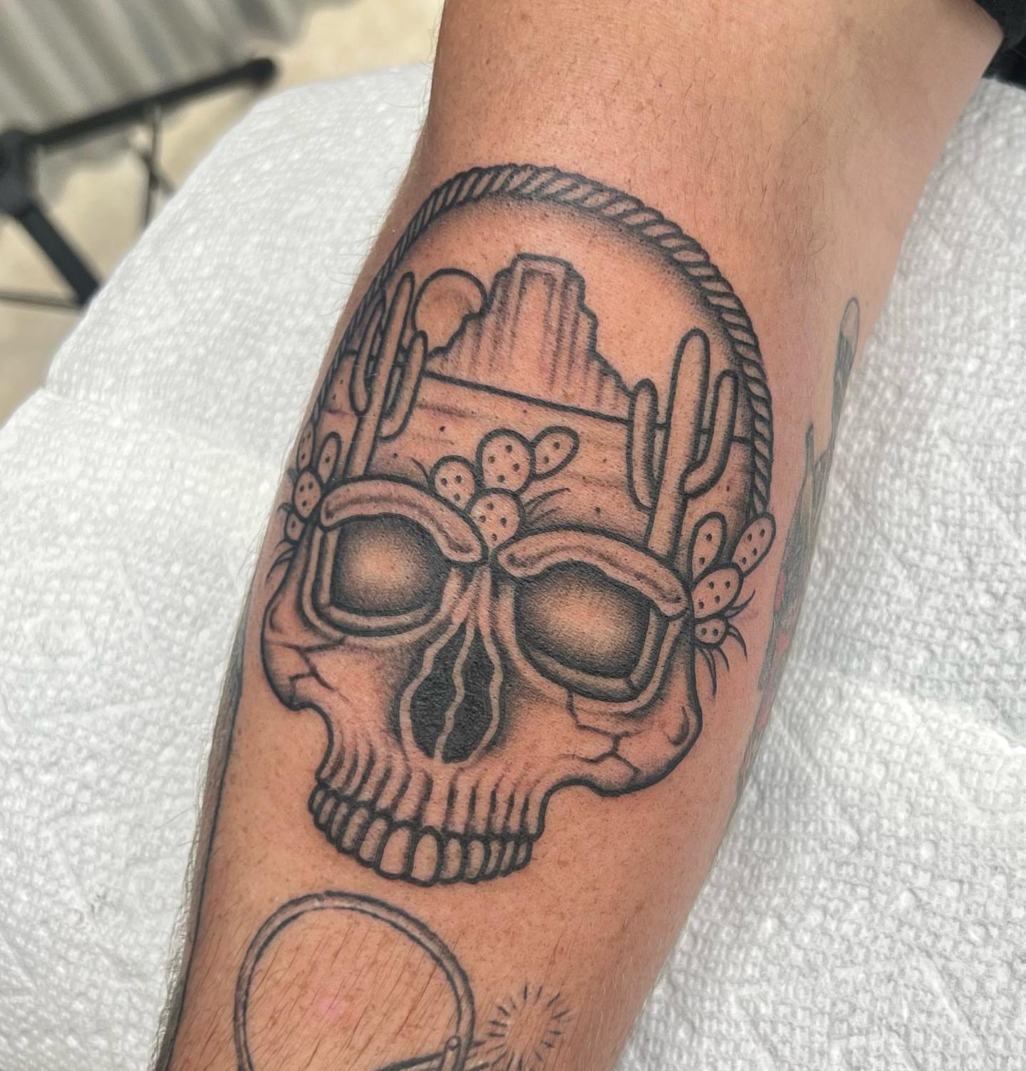 Skull with cacti black and grey tattoo on the forearm by Carson Smith, Chandler, Arizona