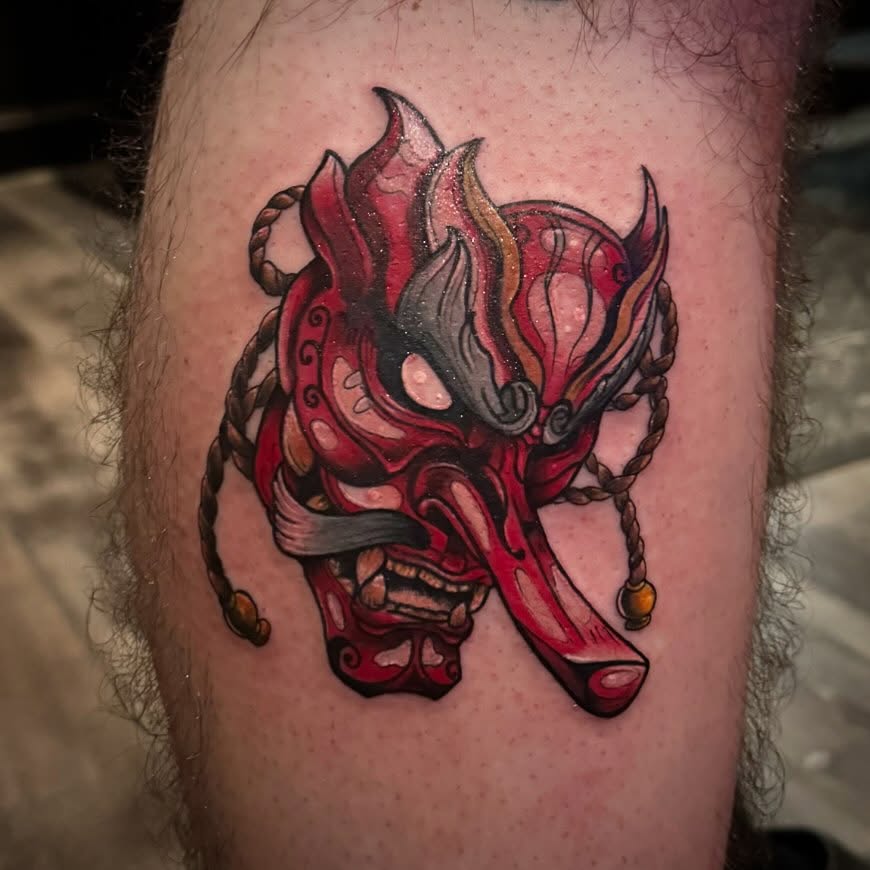 Mask japanese irezumi tattoo on the thigh by AaronAdlerTattoos.com, Cincinnati