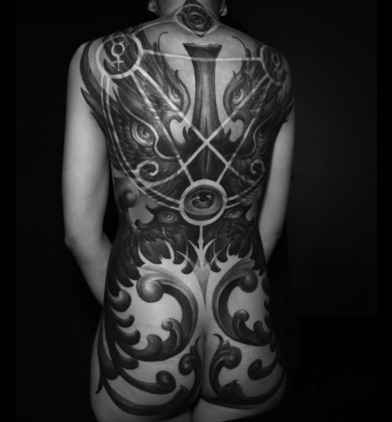 Eye and wings geometric tattoo on the back by ➕d U S T I N C H A R L e S➕, Seattle, Washington