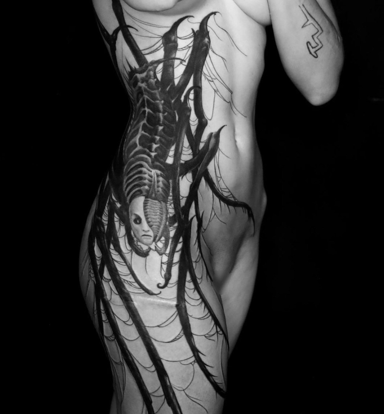 Alien creature dark realism tattoo on the torso by ➕d U S T I N C H A R L e S➕, Seattle, Washington