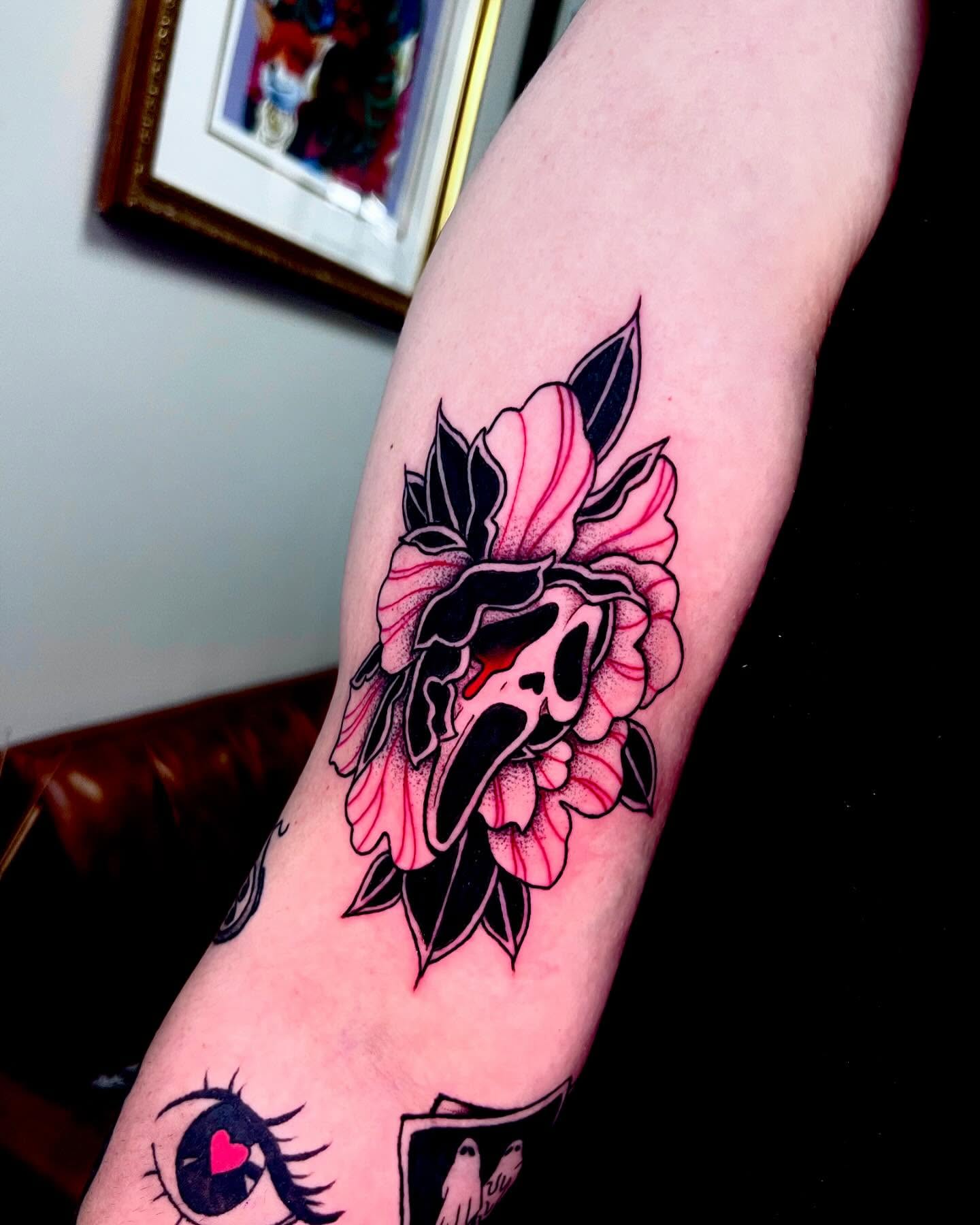 Flower with skull American traditional tattoo on the forearm by Ashley Fino, Las Vegas, Nevada