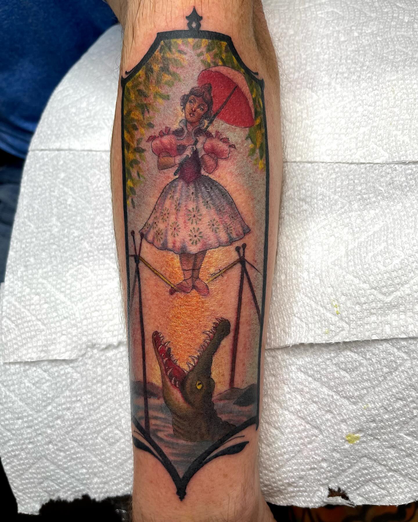 Circus performer balancing illustrative tattoo on the forearm by Holli Marie