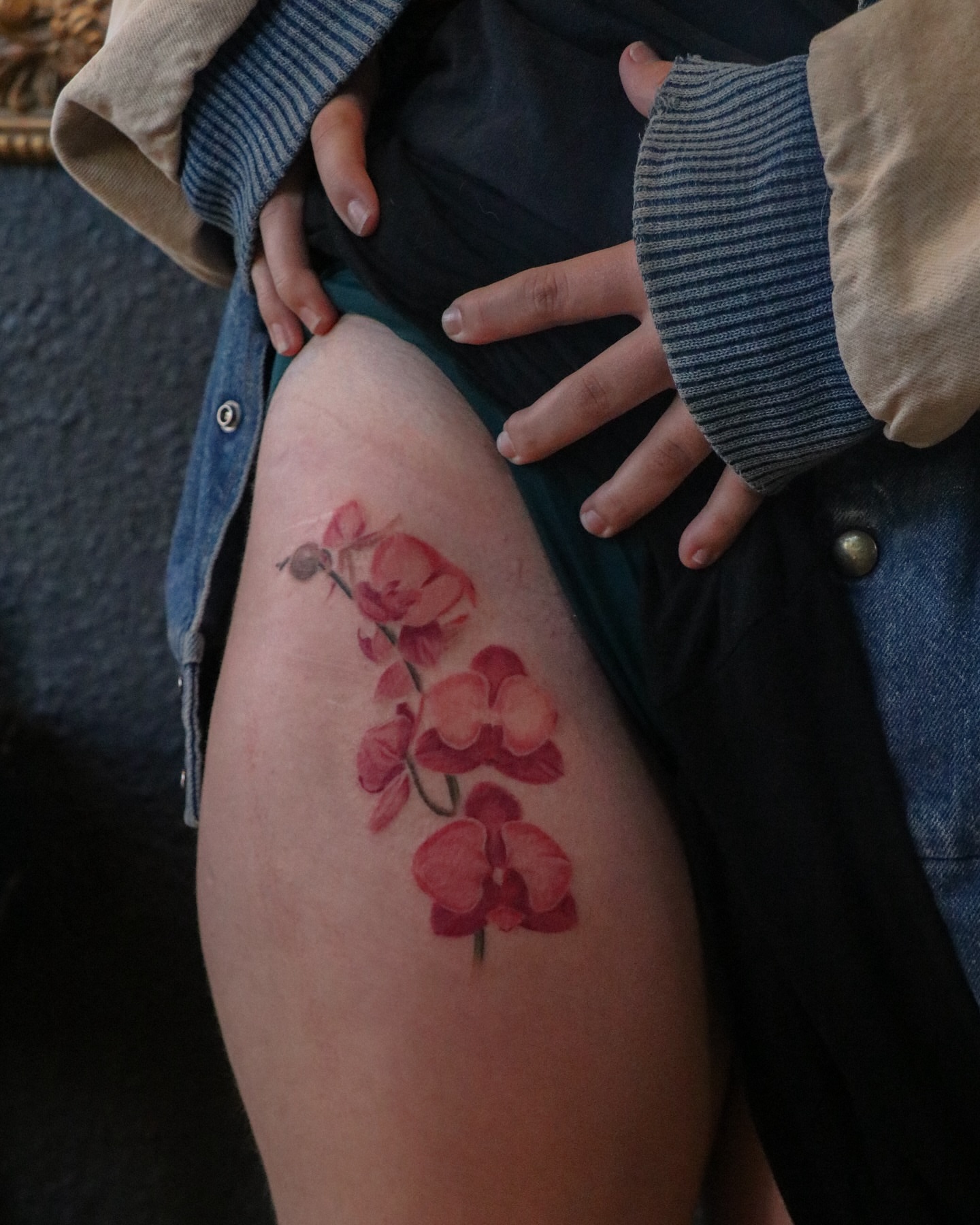 Orchid realism tattoo on the thigh by Jhenn