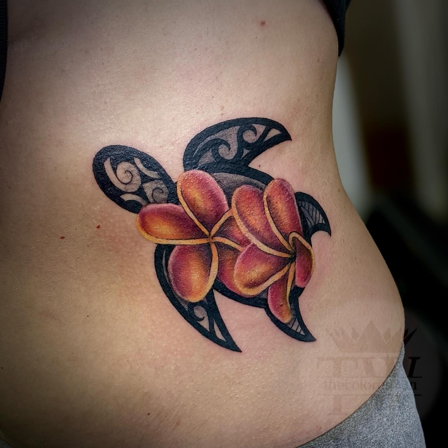 Plumeria flower American traditional tattoo on the ribs by Taylor Tha Color Queen