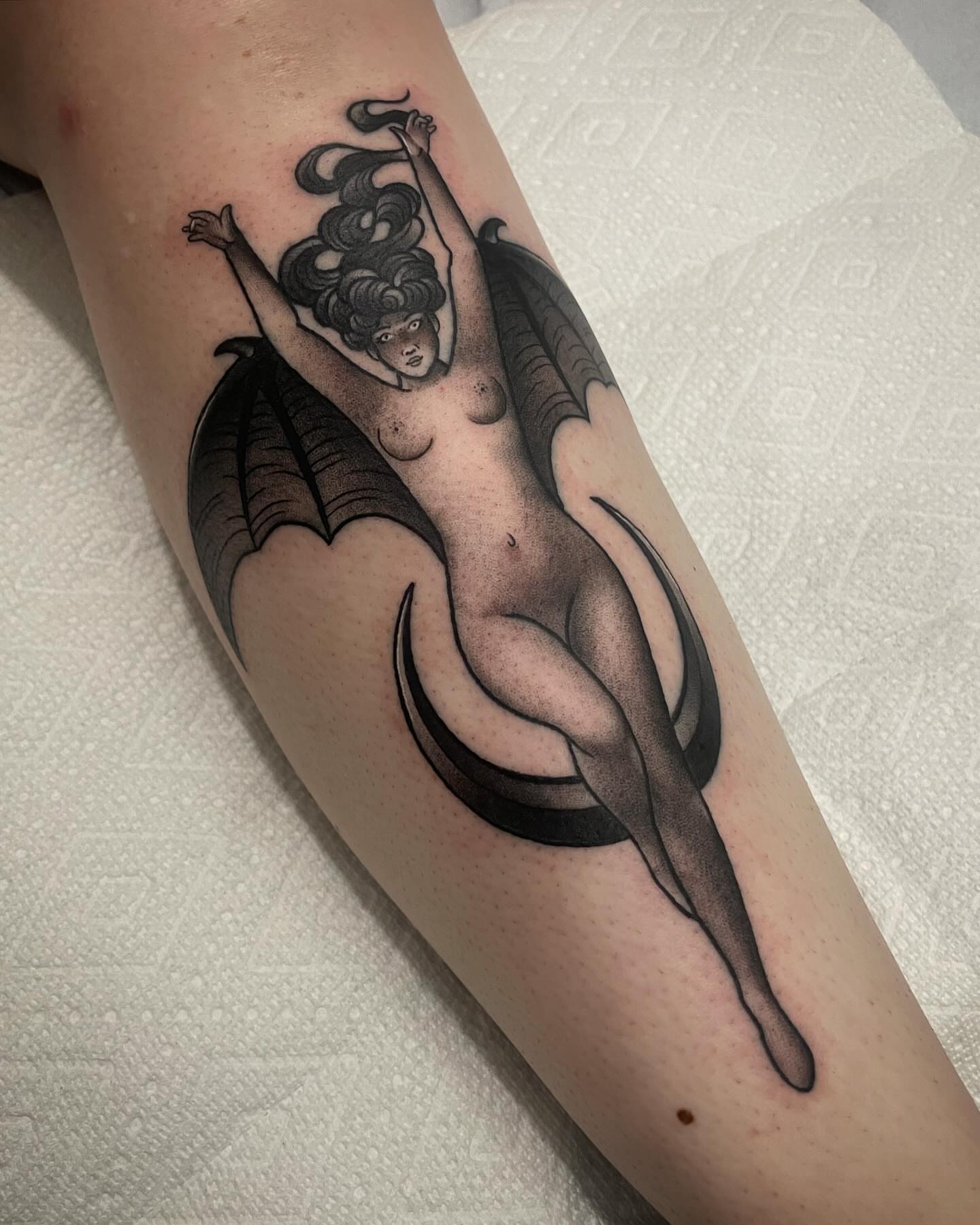 Winged woman black and grey tattoo on the forearm by Amy Jean, Minneapolis, Minnesota