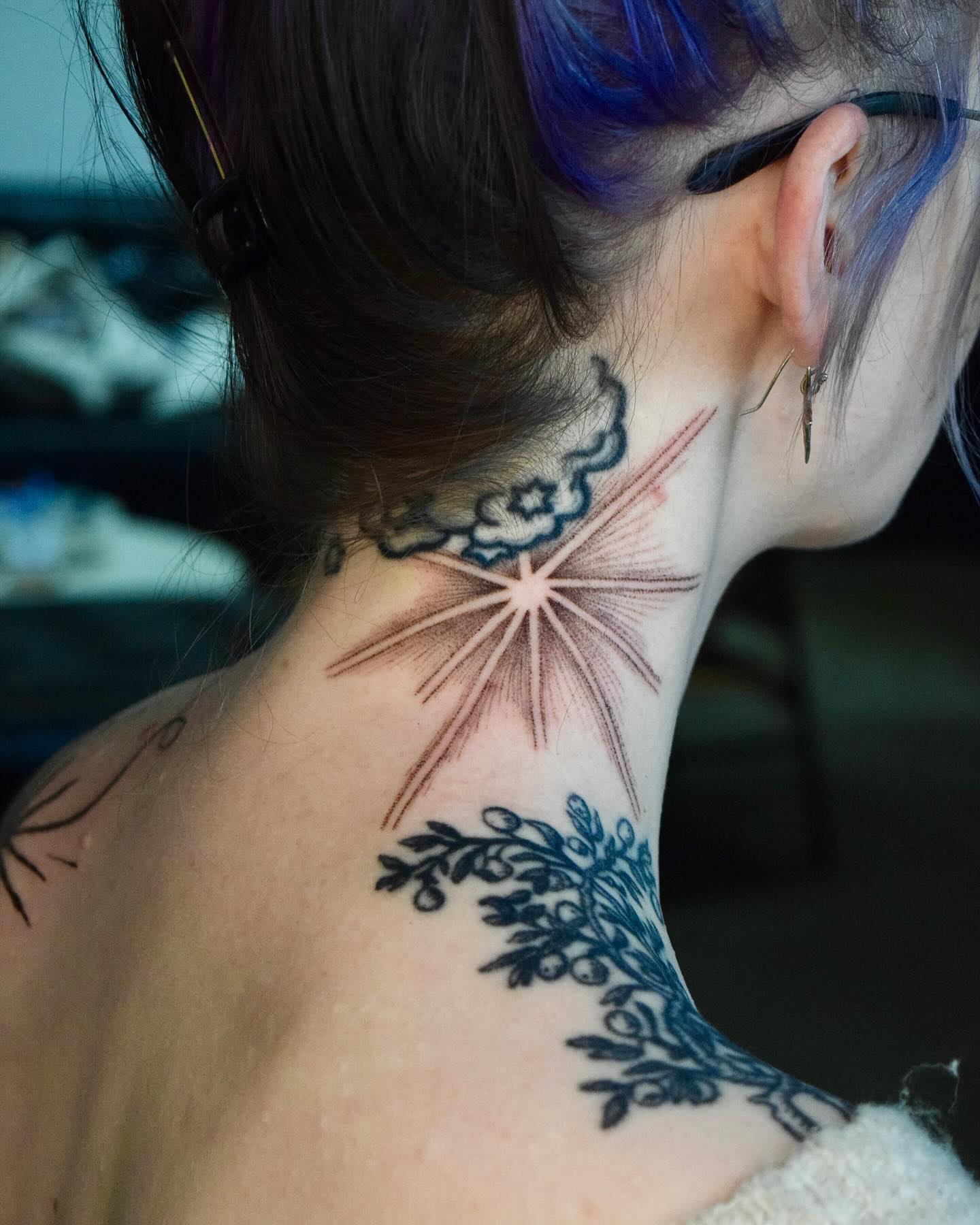 Sunburst and cloud American traditional tattoo on the neck by Stella Oh