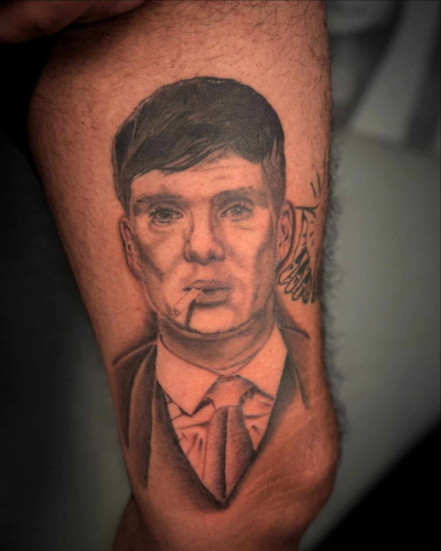 Man smoking realism tattoo on the thigh by Las Vegas Tattoo Artist