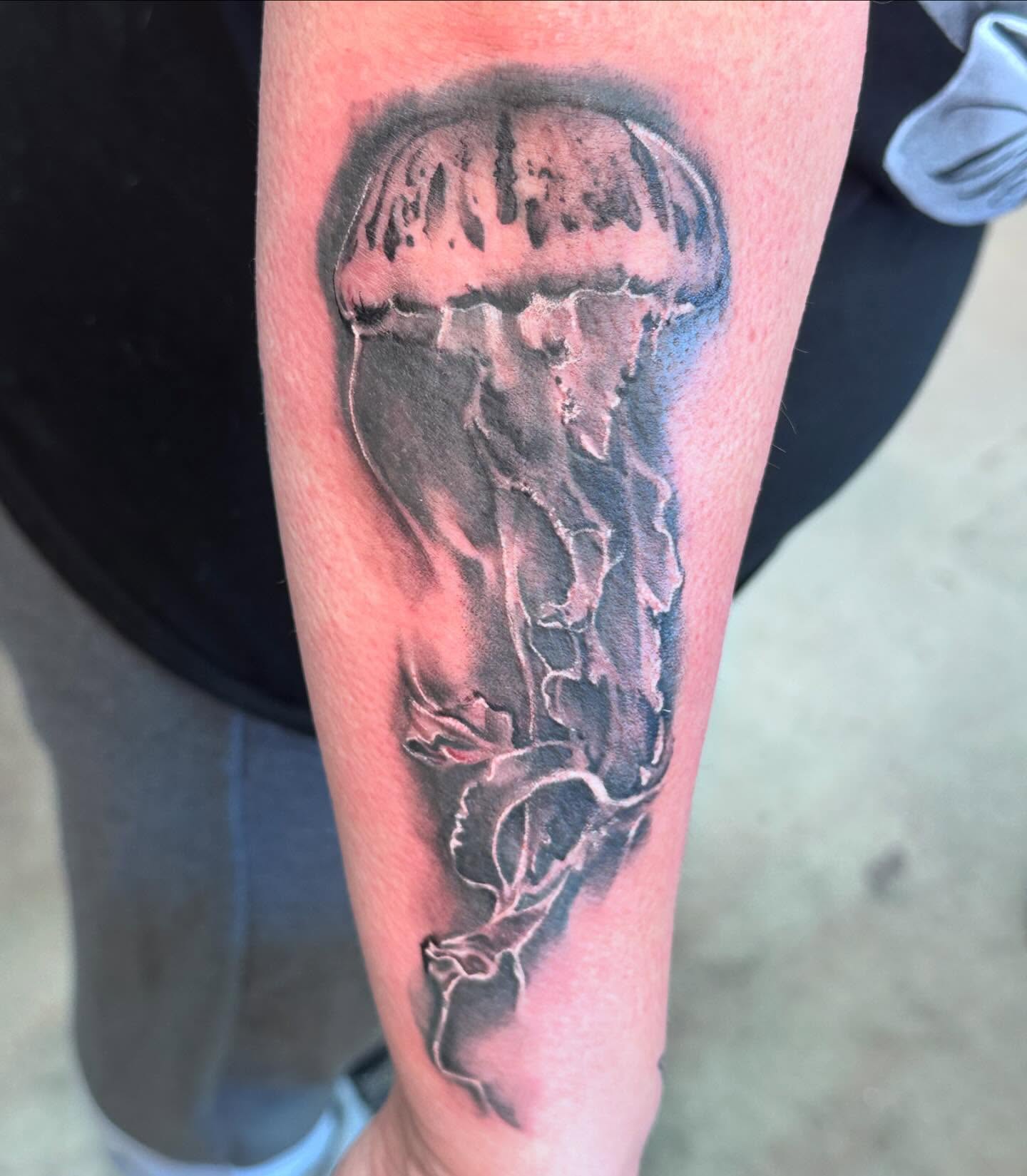 Jellyfish realism tattoo on the forearm by Shawn Cook