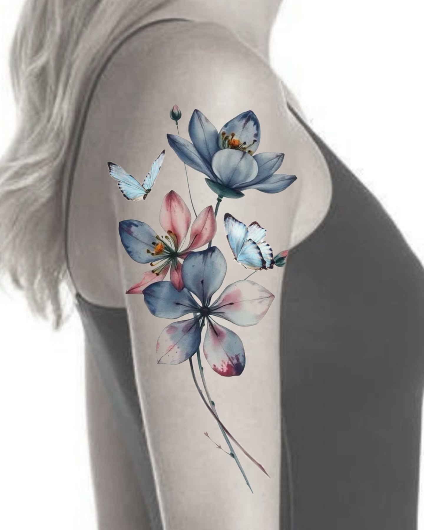 Flowers and butterflies watercolor tattoo on the upper arm by Henry
