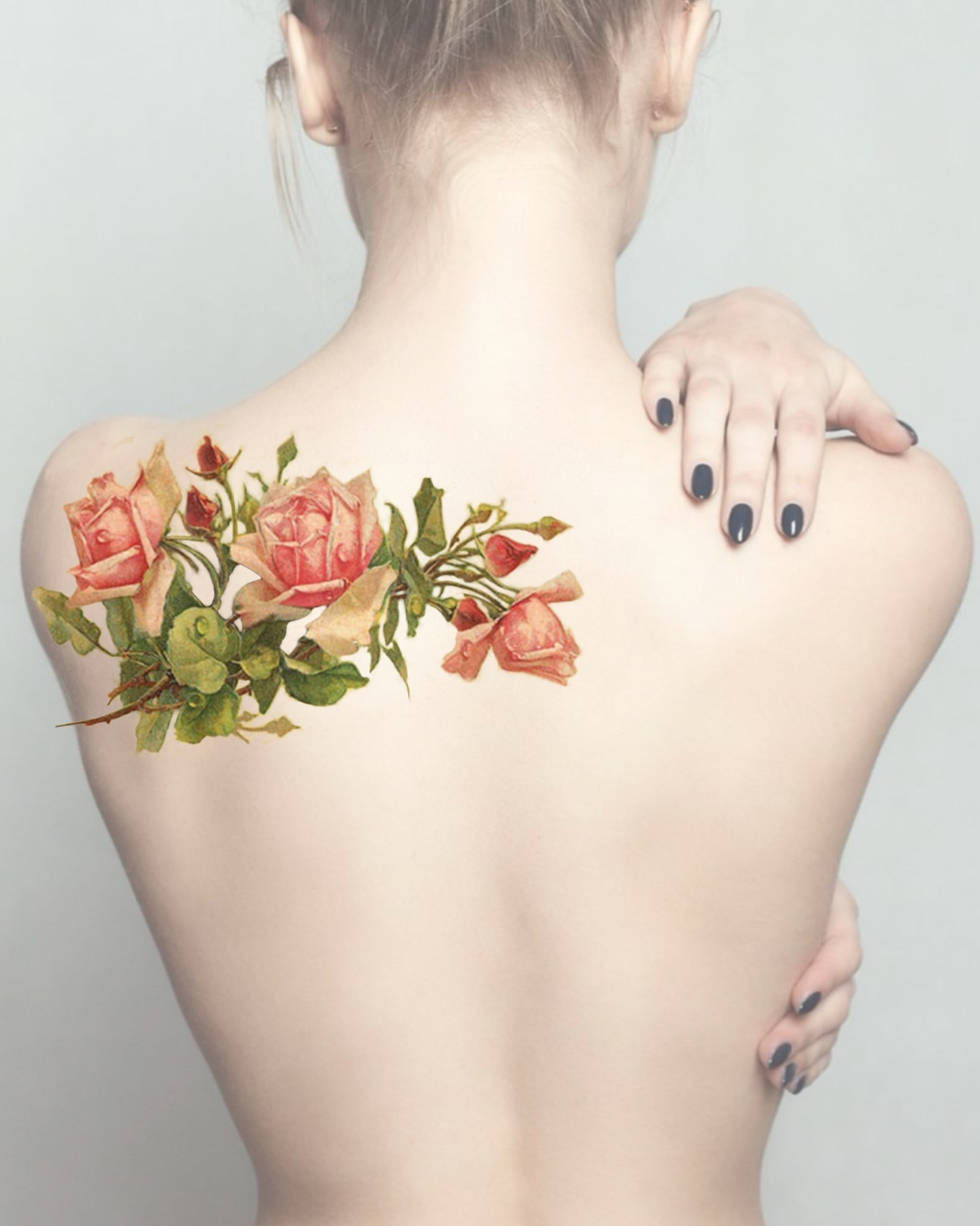 Flowers realism tattoo on the back by Henry