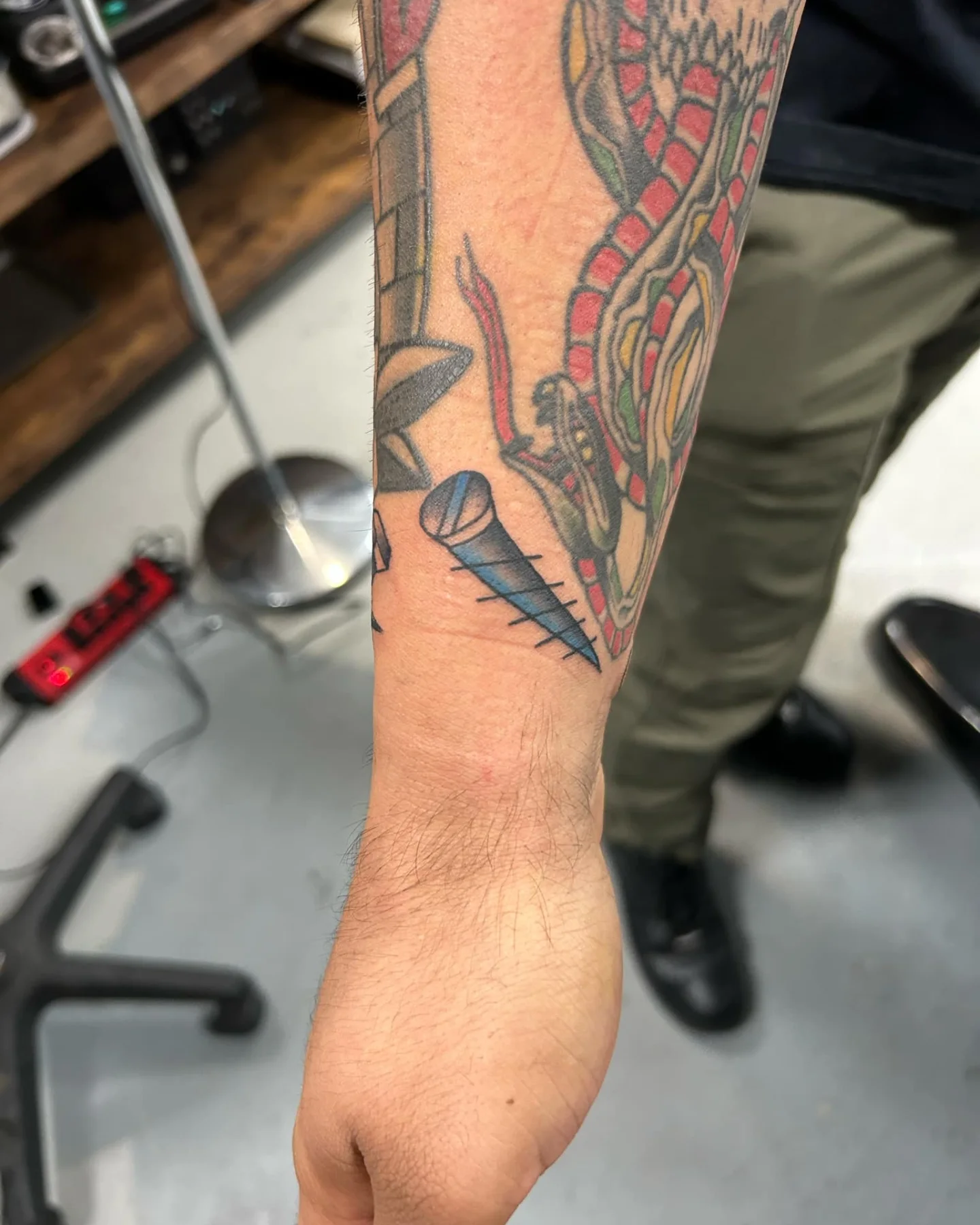 Snake and dagger American traditional tattoo on the forearm by Claudia Isabel Roman, El Paso, Texas